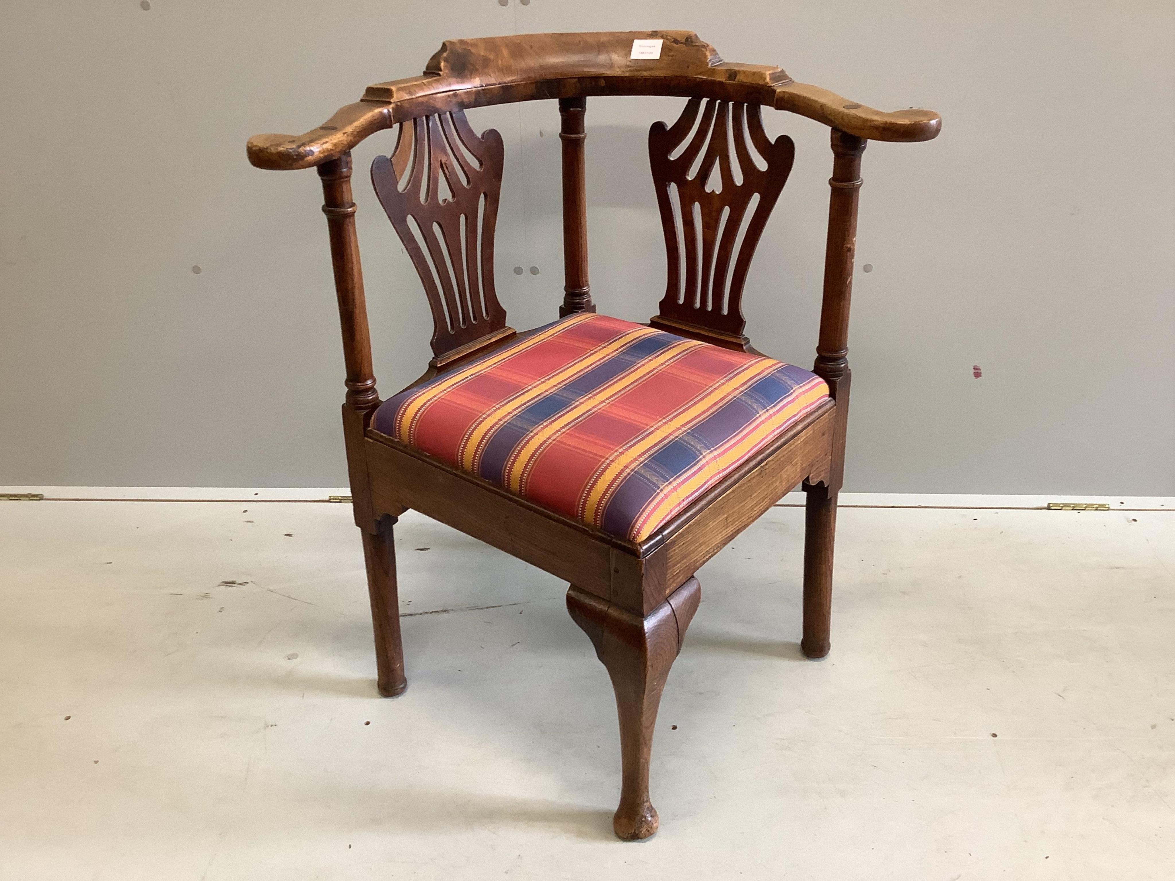 A George III Provincial elm corner elbow chair, width 77cm, depth 64cm, height 87cm. Condition - fair